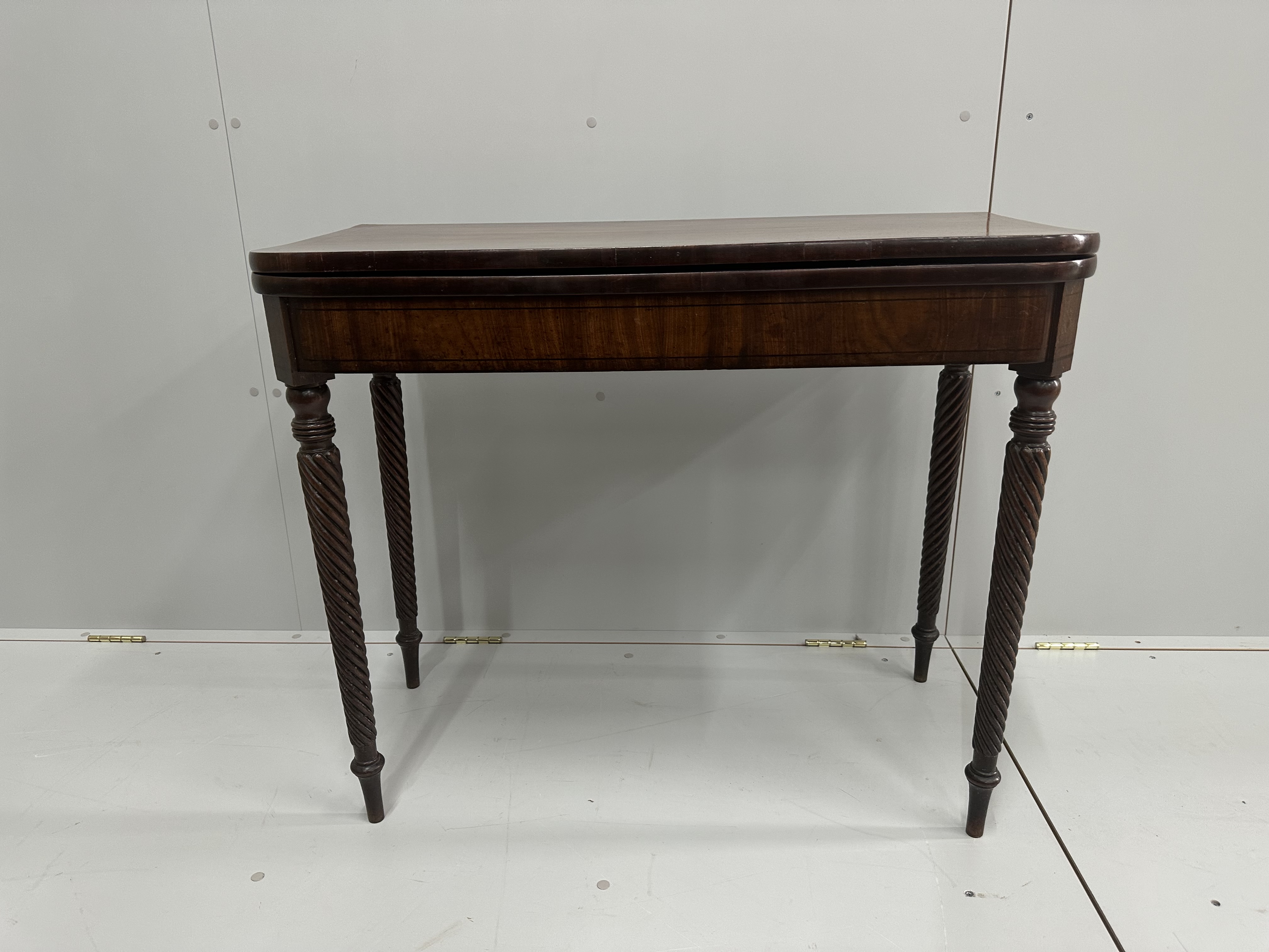 A George IV mahogany folding tea table, width 92cm, depth 46cm, height 76cm